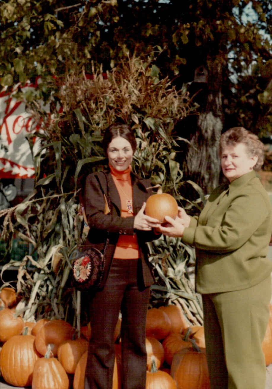 Vintage Photo of two women standing among pumpkins at Koepsel's Farm Market